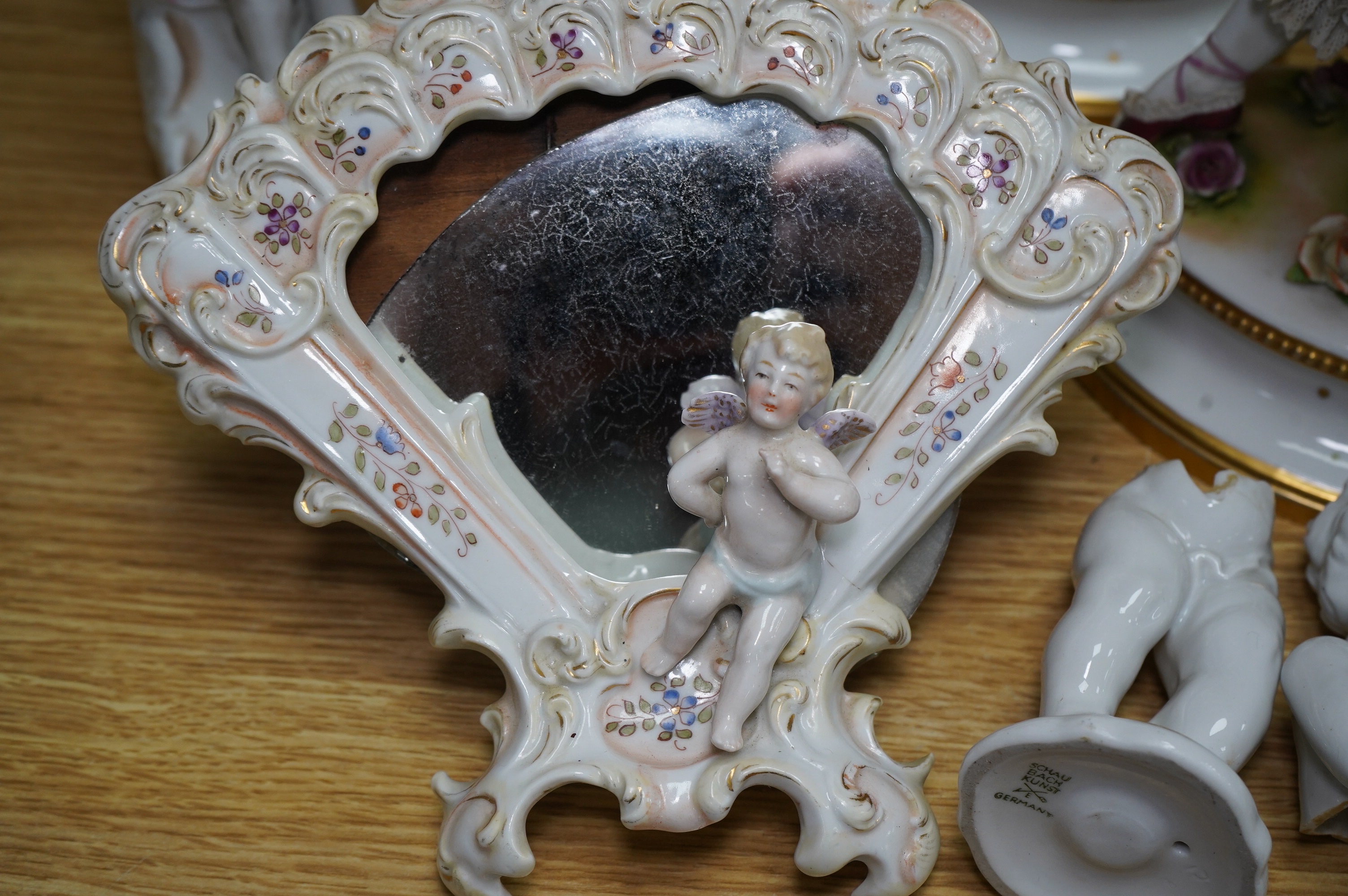 A collection of Continental porcelain ceramic figurines, including a pair of lace examples, dancing ladies and an easel mirror, largest 29cm high. Condition - mostly poor